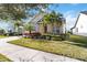 Well-maintained house with palm trees and a manicured lawn at 5014 E Fountainwood Dr, Saint Cloud, FL 34772