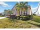 Charming curb appeal, lush landscaping, and a welcoming entrance at 5014 E Fountainwood Dr, Saint Cloud, FL 34772