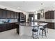 Modern kitchen featuring granite countertops and a large island at 5014 E Fountainwood Dr, Saint Cloud, FL 34772