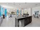 Open concept kitchen with island and stainless steel appliances at 5014 E Fountainwood Dr, Saint Cloud, FL 34772