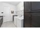 Laundry room with washer, dryer, and extra storage cabinets at 5014 E Fountainwood Dr, Saint Cloud, FL 34772