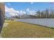 Large backyard with white vinyl fence at 534 Bristol Cir, Kissimmee, FL 34758