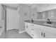 Bathroom with double vanity, granite countertop and modern fixtures at 534 Bristol Cir, Kissimmee, FL 34758