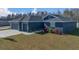 Newly built home with a two-car garage and landscaping at 534 Bristol Cir, Kissimmee, FL 34758