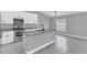 Modern kitchen with white cabinets, granite countertops and stainless steel appliances at 534 Bristol Cir, Kissimmee, FL 34758