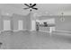 Open concept kitchen with white cabinets, granite countertops, and stainless steel appliances at 534 Bristol Cir, Kissimmee, FL 34758