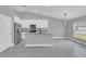 Modern kitchen with island, white cabinets and granite countertops at 534 Bristol Cir, Kissimmee, FL 34758