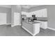 Modern kitchen with white cabinets, granite countertops and stainless steel appliances at 534 Bristol Cir, Kissimmee, FL 34758