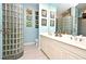 Elegant bathroom with a glass block shower and double vanity at 601 Sycamore St # 6108, Celebration, FL 34747