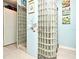 Unique bathroom with glass block feature wall and neutral color palette at 601 Sycamore St # 6108, Celebration, FL 34747