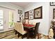 Elegant dining room with a dark wood table and six chairs at 601 Sycamore St # 6108, Celebration, FL 34747