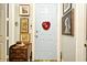 Bright entryway with light blue door and eclectic wall art at 601 Sycamore St # 6108, Celebration, FL 34747