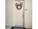 Well-lit condo front door with a festive wreath at 601 Sycamore St # 6108, Celebration, FL 34747