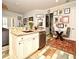 Island kitchen with granite countertops and stainless steel appliances at 601 Sycamore St # 6108, Celebration, FL 34747