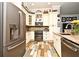Modern kitchen with updated appliances and stylish wood-look flooring at 601 Sycamore St # 6108, Celebration, FL 34747
