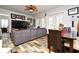 Spacious living room with sectional sofa and large TV at 601 Sycamore St # 6108, Celebration, FL 34747