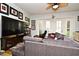 Spacious living room with sectional sofa and ceiling fan at 601 Sycamore St # 6108, Celebration, FL 34747