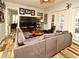 Relaxing living room with sectional sofa and access to patio at 601 Sycamore St # 6108, Celebration, FL 34747