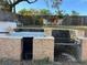 Built-in outdoor granite BBQ and seating area at 648 Tradewinds Dr, Deltona, FL 32738