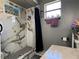 Modern bathroom with a walk-in shower and marble tile at 648 Tradewinds Dr, Deltona, FL 32738