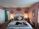 Main bedroom with a queen-size bed and pink walls at 648 Tradewinds Dr, Deltona, FL 32738