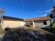 House exterior with solar panels on the roof at 648 Tradewinds Dr, Deltona, FL 32738