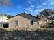 Rear view of a single-story house with a yard at 648 Tradewinds Dr, Deltona, FL 32738