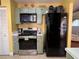Galley kitchen with built-in microwave, oven and refrigerator at 648 Tradewinds Dr, Deltona, FL 32738