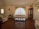 Living room with two sofas, coffee table, and wood floors at 648 Tradewinds Dr, Deltona, FL 32738