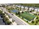 Aerial view of the community showing the sports courts, landscaping, and surrounding houses at 701 Ocean Course Ave, Davenport, FL 33896