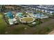 Aerial view of community pool, water park, and residential buildings at 701 Ocean Course Ave, Davenport, FL 33896