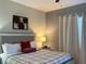 Cozy bedroom with a comfortable bed, decorative accents, and soft lighting, creating a relaxing retreat at 701 Ocean Course Ave, Davenport, FL 33896