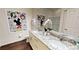 Bathroom with double vanity and Mickey Mouse decor at 8906 Shine Dr, Kissimmee, FL 34747