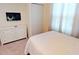 Bright bedroom with a comfy bed and white dresser at 8906 Shine Dr, Kissimmee, FL 34747