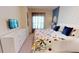 Spacious bedroom with a king-size bed and dresser at 8906 Shine Dr, Kissimmee, FL 34747