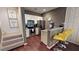 Modern kitchen with stainless steel appliances and a breakfast bar at 8906 Shine Dr, Kissimmee, FL 34747