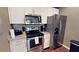Modern kitchen with stainless steel appliances and granite countertops at 8906 Shine Dr, Kissimmee, FL 34747