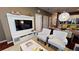 Living room with built-in entertainment center and comfy armchairs at 8906 Shine Dr, Kissimmee, FL 34747