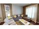 Spacious living room with sectional sofa and large windows at 8906 Shine Dr, Kissimmee, FL 34747