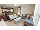 Living Room with gray sectional sofa and yellow accents at 8906 Shine Dr, Kissimmee, FL 34747