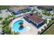 Aerial view of community pool with lounge chairs and clubhouse at 8906 Shine Dr, Kissimmee, FL 34747