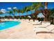 Resort-style pool area with lounge chairs and pergola at 8906 Shine Dr, Kissimmee, FL 34747