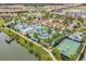 Aerial view of community pool, lake, and amenities at 8953 Zurich Ln, Kissimmee, FL 34747