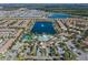 Aerial view of community pool, lake, and surrounding homes at 8953 Zurich Ln, Kissimmee, FL 34747