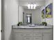 Double vanity bathroom with granite countertop at 8953 Zurich Ln, Kissimmee, FL 34747
