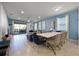 Bright dining room with a large table and access to the back patio at 8953 Zurich Ln, Kissimmee, FL 34747