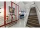 Bright and spacious entryway with stairs, a console table, and Mickey Mouse artwork at 8953 Zurich Ln, Kissimmee, FL 34747