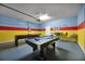 Fun game room features pool table, foosball, and seating at 8953 Zurich Ln, Kissimmee, FL 34747