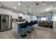 Modern kitchen with stainless steel appliances and a blue island at 8953 Zurich Ln, Kissimmee, FL 34747