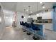 Modern kitchen with stainless steel appliances and a blue island at 8953 Zurich Ln, Kissimmee, FL 34747